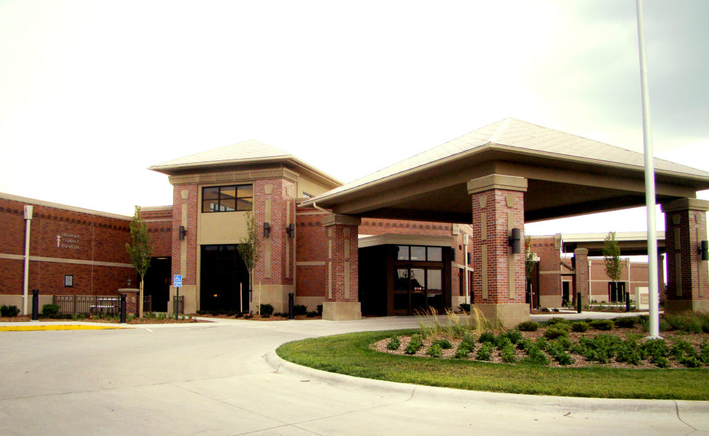 Front entrance and brick drive-under awning of Fillmore County Hospital in Geneva, Nebraska