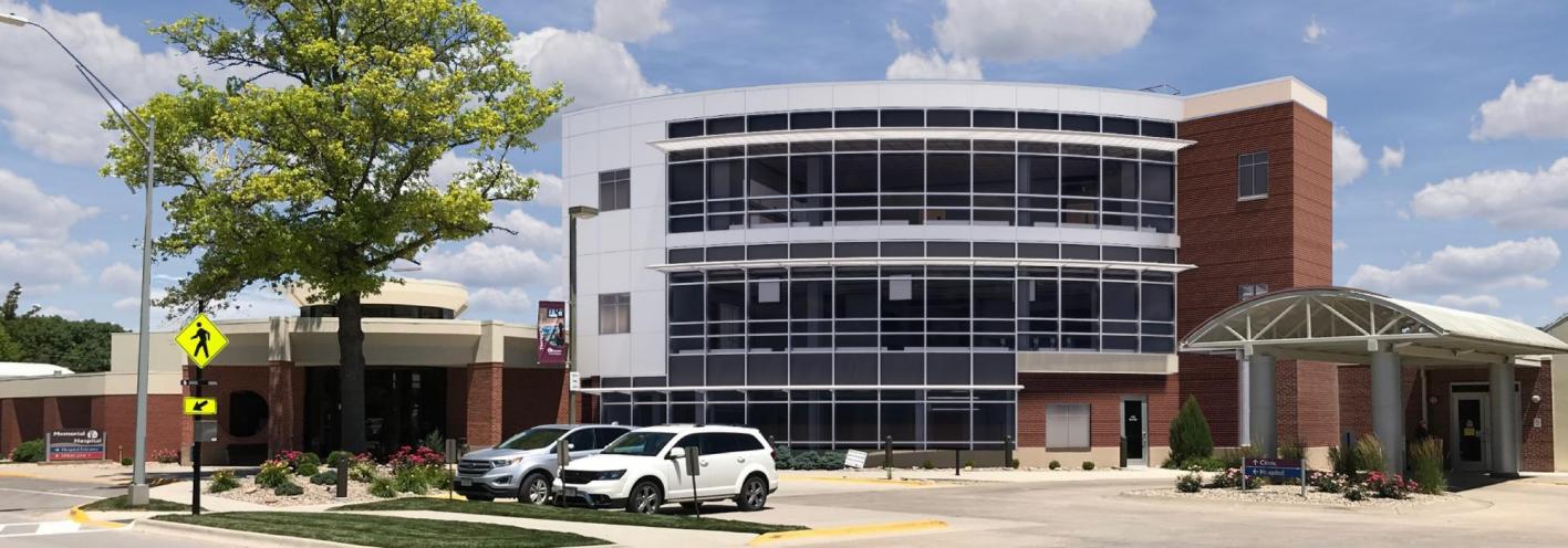 Memorial Health Systems medical building with brick, white siding and many windows in Seward, Nebraska