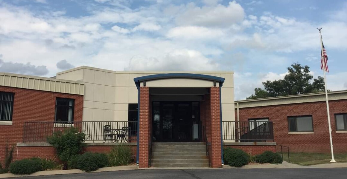 Front entrance with brick pillars and awning of Pawnee City Memorial Hospital in Pawnee City, Nebraska